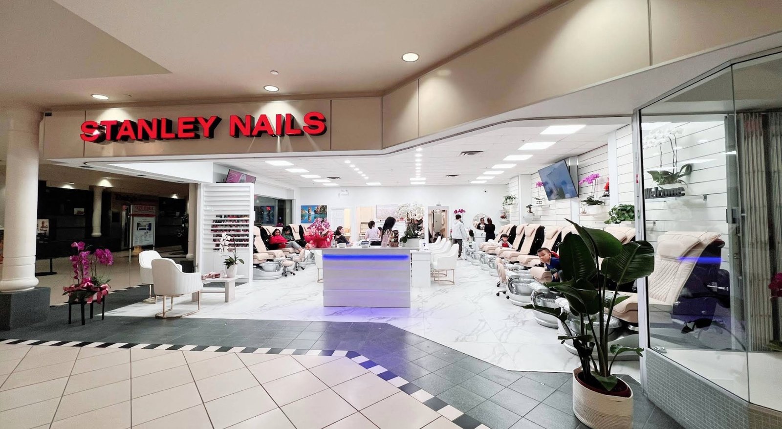 Reception and nail colour wall at Stanley Nails Delta