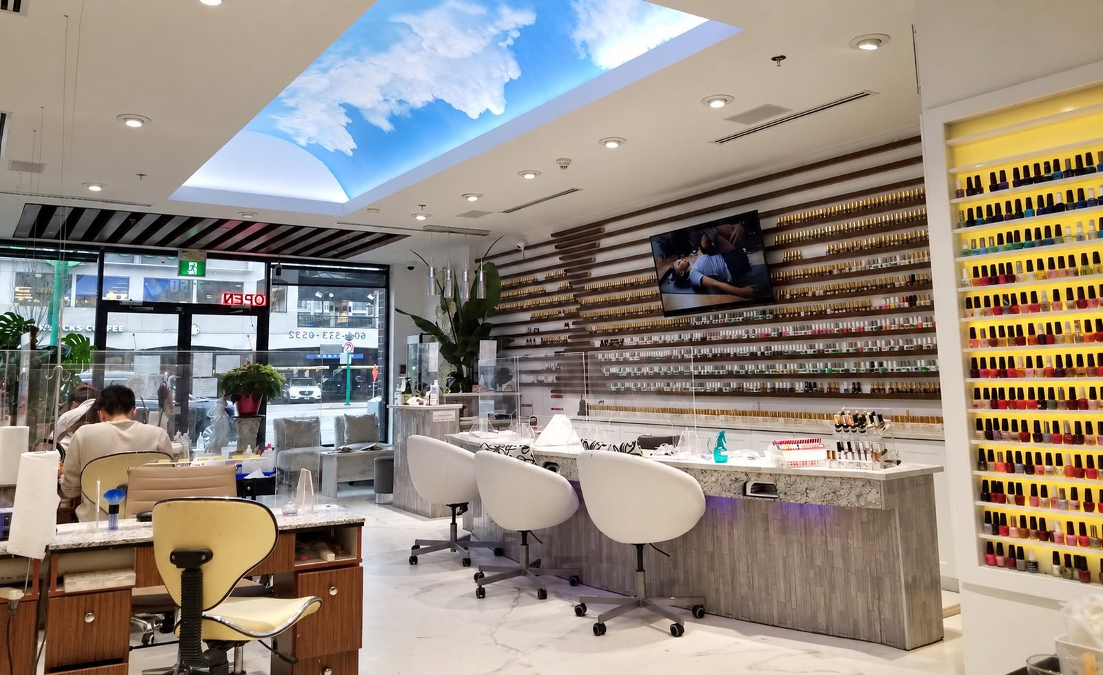 Manicure desks and polish wall at Stanley Nails Highgate